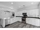 Beautiful kitchen featuring stainless steel appliances, white cabinetry, and light countertops at 29374 N 125Th Dr, Peoria, AZ 85383