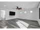 Open living area with luxury flooring and ceiling fan, offering plenty of natural light at 29374 N 125Th Dr, Peoria, AZ 85383