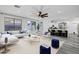 Open living room with backyard view, plush furniture, and view to the kitchen area at 29374 N 125Th Dr, Peoria, AZ 85383