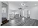 Expansive loft space with an open layout, multiple windows, sleek flooring, and modern lighting fixtures at 29374 N 125Th Dr, Peoria, AZ 85383