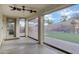 This covered patio with shades overlooks a backyard with artificial turf and a play area at 29374 N 125Th Dr, Peoria, AZ 85383