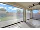 Enclosed patio with a view of the backyard, which features artificial turf and a playset at 29374 N 125Th Dr, Peoria, AZ 85383