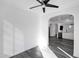 Bright, open sunroom featuring an arched doorway with views of the kitchen and dining area at 29374 N 125Th Dr, Peoria, AZ 85383