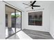 Bright sunroom with sliding glass doors, a ceiling fan, and views of the outdoor patio at 29374 N 125Th Dr, Peoria, AZ 85383