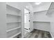 Walk-in closet with shelving and doorway to bathroom at 29374 N 125Th Dr, Peoria, AZ 85383