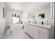 Bright bathroom showcasing double sinks, a soaking tub by the window, and modern finishes throughout the space at 3401 N 37Th St # 12, Phoenix, AZ 85018