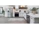 Modern kitchen featuring stainless steel appliances, white cabinetry, and open shelving at 3401 N 37Th St # 12, Phoenix, AZ 85018