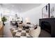 Cozy living room with fireplace, comfortable seating, and an open view into the dining area at 3401 N 37Th St # 12, Phoenix, AZ 85018