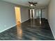 Bedroom with wood-look flooring, ceiling fan, and closet at 3515 E Winchcomb Dr, Phoenix, AZ 85032