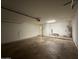 Spacious two car garage with lighting, access door, and ample storage capacity at 3515 E Winchcomb Dr, Phoenix, AZ 85032