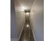Hallway with wood look flooring and neutral wall paint at 3515 E Winchcomb Dr, Phoenix, AZ 85032
