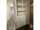 Hallway featuring a decorative built in cabinet with doors at 3515 E Winchcomb Dr, Phoenix, AZ 85032