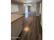 Open kitchen area with wood floors and an island, perfect for entertaining at 3515 E Winchcomb Dr, Phoenix, AZ 85032
