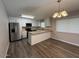 Bright kitchen features white cabinets, stainless steel appliances, and a breakfast bar at 3515 E Winchcomb Dr, Phoenix, AZ 85032