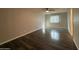 An open living room featuring wood-look floors and a ceiling fan at 3515 E Winchcomb Dr, Phoenix, AZ 85032