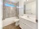 Updated bathroom features a shower and tub combination and a modern vanity at 3527 N Kashmir --, Mesa, AZ 85215
