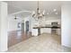 Open kitchen boasts stainless steel appliances, white cabinetry, and a view to the living area at 3527 N Kashmir --, Mesa, AZ 85215