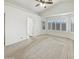 The spacious main bedroom has a ceiling fan, and a door to the en suite bathroom with plantation shutters at 3527 N Kashmir --, Mesa, AZ 85215