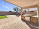 Covered patio with built-in grill, fire pit, pavers, and synthetic grass for outdoor entertaining at 3527 N Kashmir --, Mesa, AZ 85215