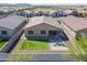 Aerial view showcases outdoor firepit, covered patio, and private backyard at 37051 N Rhinelander Dr, San Tan Valley, AZ 85140