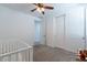 Bright bedroom with a sliding closet door and a crib at 37051 N Rhinelander Dr, San Tan Valley, AZ 85140