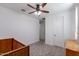 Empty bedroom with carpet, a ceiling fan and two doors at 37051 N Rhinelander Dr, San Tan Valley, AZ 85140