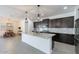 Spacious kitchen with an island, stainless appliances, ample cabinetry, and an adjacent dining area at 37051 N Rhinelander Dr, San Tan Valley, AZ 85140