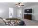 Relaxing main bedroom with a ceiling fan, TV and access to a bathroom at 37051 N Rhinelander Dr, San Tan Valley, AZ 85140