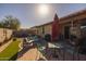 Inviting backyard featuring a patio with dining and sitting areas at 40802 W Portis Dr, Maricopa, AZ 85138