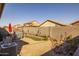 Cozy backyard featuring gravel, small garden area, bench, and enclosed with a block wall at 40802 W Portis Dr, Maricopa, AZ 85138