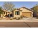 Lovely, single-story home with a charming entrance and an attached two-car garage at 40802 W Portis Dr, Maricopa, AZ 85138