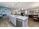 Kitchen island with stainless steel appliances, undermount sink, and pendant lighting at 40802 W Portis Dr, Maricopa, AZ 85138