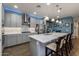 Well-equipped kitchen featuring a spacious island, sleek finishes, and ample counter space at 40802 W Portis Dr, Maricopa, AZ 85138