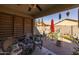 Relaxing covered patio area with comfortable seating and stylish decor at 40802 W Portis Dr, Maricopa, AZ 85138