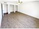 Bedroom featuring two large closets and neutral laminate flooring at 4119 N 78Th Ave, Phoenix, AZ 85033