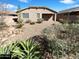 A charming backyard features desert landscaping and provides a private outdoor living space at 4127 W Acorn Valley Trl, New River, AZ 85087