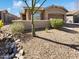 Charming single-story home featuring desert landscaping, an attached garage, and a welcoming front entry at 4127 W Acorn Valley Trl, New River, AZ 85087