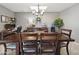 Formal dining room featuring stylish chandelier, neutral tones, and a built-in workstation at 419 N Valencia Dr, Chandler, AZ 85226
