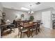Formal dining area with chandelier, neutral color palette, and a dedicated workspace at 419 N Valencia Dr, Chandler, AZ 85226