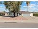Charming single-story home with a well-manicured front yard and attached two-car garage at 419 N Valencia Dr, Chandler, AZ 85226