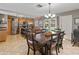 Open-concept dining area adjoining kitchen, featuring modern stainless appliances and tile floors at 419 N Valencia Dr, Chandler, AZ 85226