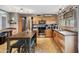 Modern kitchen with stainless appliances, plentiful storage, breakfast bar, and tile floors at 419 N Valencia Dr, Chandler, AZ 85226