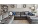 Comfortable living room features a plush sectional sofa, decorative wall art, and stylish shelving at 419 N Valencia Dr, Chandler, AZ 85226