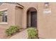 Close up of the front door and address of the home in a stucco facade at 42951 W Sandpiper Dr, Maricopa, AZ 85138