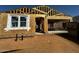 Exterior view of a new home under construction with visible frame, window opening, and garage at 4296 E Brook Lynn Pl, San Tan Valley, AZ 85140