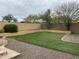 Artificial turf backyard, framed by block walls and rock landscaping, offering a low-maintenance outdoor space at 4402 E Creosote Dr, Cave Creek, AZ 85331