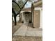 Inviting front entrance with a security door, desert landscaping, and a well-maintained walkway at 4402 E Creosote Dr, Cave Creek, AZ 85331