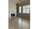 Bright living room with neutral walls, a fireplace, and large windows providing natural light at 4402 E Creosote Dr, Cave Creek, AZ 85331