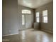 Bright living room featuring tile flooring, arched windows, and neutral paint, creating an open space at 4402 E Creosote Dr, Cave Creek, AZ 85331