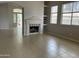 Spacious living room with tile flooring and a fireplace, perfect for entertaining and relaxation at 4402 E Creosote Dr, Cave Creek, AZ 85331